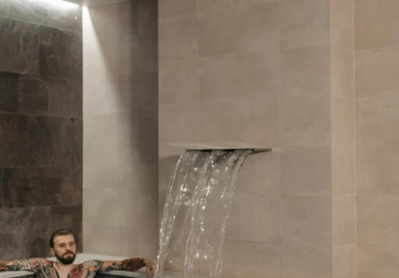 A couple enjoying a relaxing moment in a modern indoor pool.