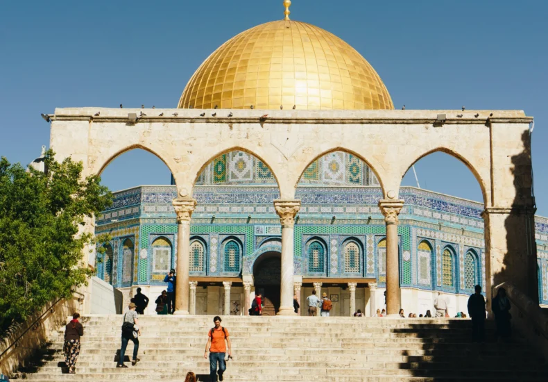Stunning view of the Dome of the Rock in Jerusalem under clear blue skies.