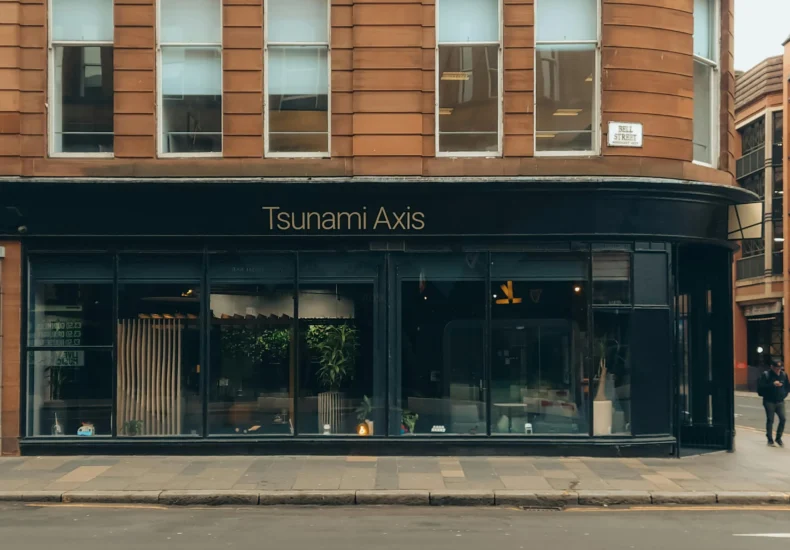 Elegant storefront of Tsunami Axis in urban setting, Bell Street.
