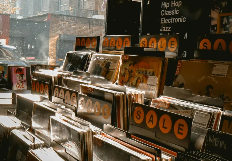 Vintage vinyl records on sale in a London store, showcasing a variety of genres.