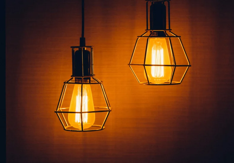 Close-up of glowing vintage pendant light bulbs creating a warm, inviting ambiance.